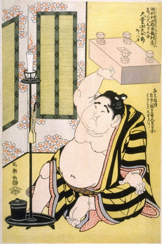 大童山文五郎が重い碁盤を片手で持ち上げる浮世絵。